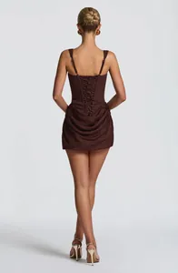 Back view of brown sleeveless mini dress with lace-up corset and draped skirt detail