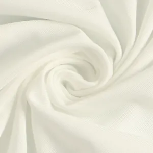 Macro view of soft white breathable mesh fabric texture showing detailed knit patterns