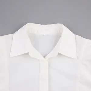Detailed macro view of the white cotton French style blouse collar and neckline structure