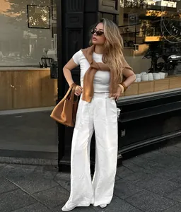 Street style outfit with white cotton-linen high-waisted wide-leg pants for summer