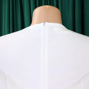 Detailed back view of a white elegant dress featuring a concealed zipper closure.