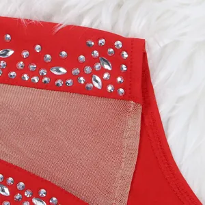 Close-up of red rhinestone detailing and sheer mesh panel on a sexy cocktail dress
