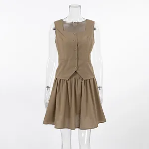Front view of khaki two-piece cotton linen set with button-up vest and A-line skirt.