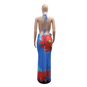 Detailed back view of a blue 3-piece floral bikini set featuring a long mesh cover-up skirt