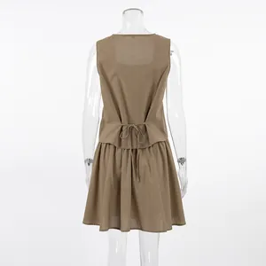Back view of elegant khaki cotton linen vest and mini A-line skirt set for women