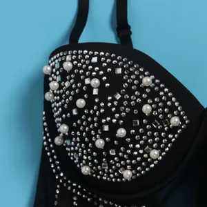 Close-up of black dress bodice with exquisite pearl and rhinestone embellishments