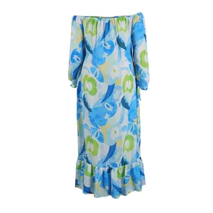 Close-up detail of off-the-shoulder long sleeve maxi dress with vibrant blue floral print