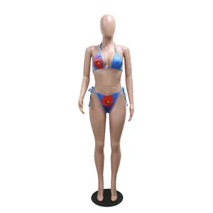 Full front view detail of the blue floral print bikini set on a model mannequin