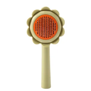 Sunflower shaped pet grooming brush for cats and dogs in vibrant green and orange