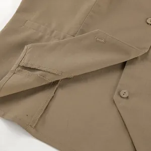 Detailed macro view showing khaki cotton linen vest hem stitching and buttonholes