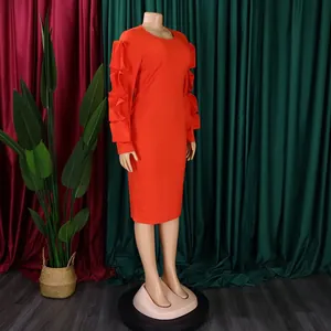Side view of elegant orange long sleeve midi dress with ruffle sleeve details