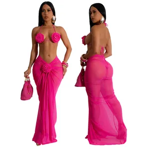 Fuchsia 3-piece bikini set featuring 3D floral appliqués and a sheer mesh wrap skirt