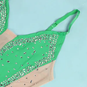 Detailed view of shimmering silver rhinestones on green and beige mesh camisole evening dress