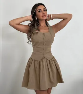 Detail view of a French style khaki cotton linen vest and pleated mini skirt set.