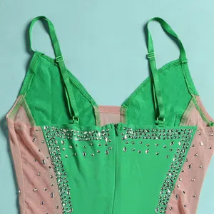 Detailed back view of green rhinestone dress with mesh panels and adjustable straps