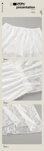 Vues rapprochées détaillées d'une élégante jupe en dentelle blanche transparente.