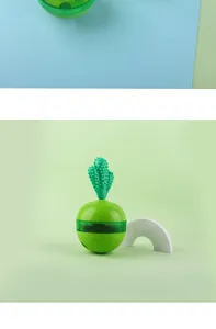 Detailed macro view of a green cactus-shaped pet tumbler slow feeder toy for dogs