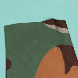 Close-up detail of the durable camouflage pattern fabric on the slim-fit dress.