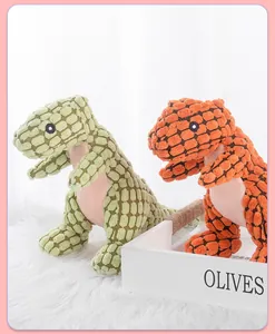 Close-up view of two colorful plush dinosaur dog toys for pet teeth cleaning
