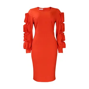 Close-up of elegant orange-red long sleeve midi dress with tiered ruffle sleeve detail