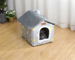 Detail of cozy house-shaped pet bed with star pattern and soft plush roof