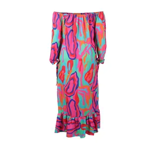 Detailed view of the vibrant psychedelic print on an off-shoulder maxi dress.