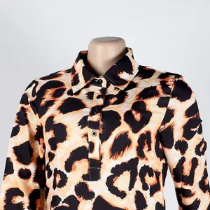 Detailed view of a leopard print slim-fit dress with a classic collar and button placket.