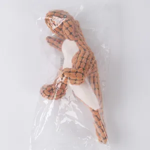 Orange textured plush dinosaur squeaky dog toy for teething and interactive play