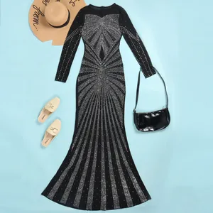 Elegant floor-length black evening dress with shimmering rhinestone sunburst pattern