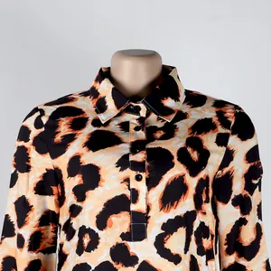 Close-up detail of leopard print shirt showing lapel collar and button-down placket
