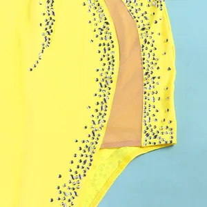 Close-up detail of silver rhinestones and mesh insert on a yellow sexy dress.