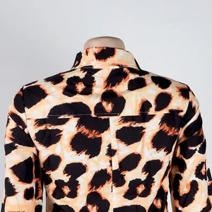 Close-up back detail of stylish leopard print button-up shirt with vibrant orange patterns