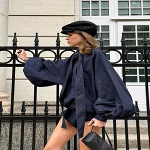 Stylish blue denim two-piece set featuring puff sleeves and high-waisted shorts