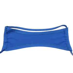 Detail of cobalt blue bikini top fabric with double-stitched seams and thin straps.