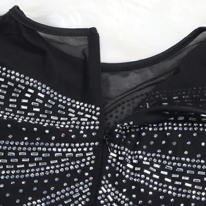 Detail shot of black mesh dress with glittering rhinestones and hidden zipper