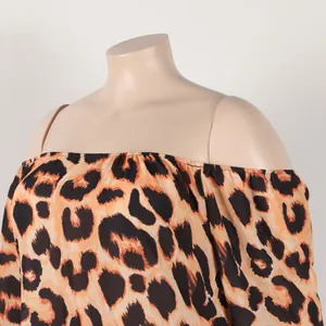 Close-up detail showing leopard print and elasticated off-the-shoulder neckline on dress