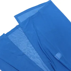 Detailed macro view of vibrant blue sheer mesh fabric showing fine texture and hem.