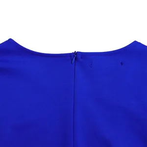 Close-up detail of the invisible back zipper on a royal blue elegant long-sleeved dress