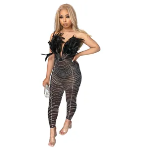 Sexy black sleeveless jumpsuit with silver rhinestones and feather accents on the chest