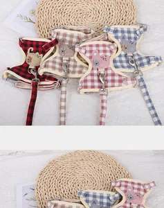 Detailed view of colorful plaid cotton cat harness and leash sets in a cozy setting