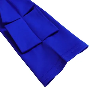 Detailed macro view of layered cuff design on elegant royal blue long sleeve dress
