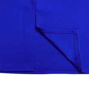 Close-up detail of royal blue dress hem featuring elegant side slit and neat stitching