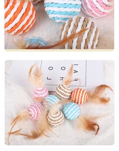 Colorful paper rope cat toy balls with feathers shown on a white textured background