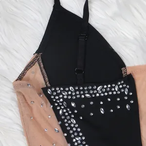 Close-up detail of rhinestone embellishments on a sexy sheer mesh camisole dress.