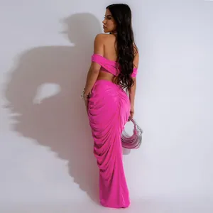 Back view of pink ruched two-piece set with off-shoulder top and floor-length skirt