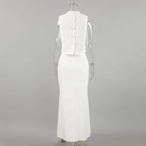 Back view detail of a minimalist white two-piece vest and long skirt set with buttons