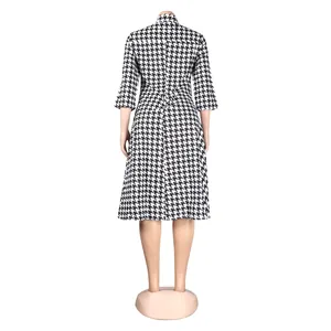 Back view of a classic black and white houndstooth slim fit lapel collar dress.