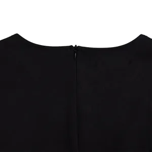 Close-up detail of the back invisible zipper on this elegant black long sleeve dress.