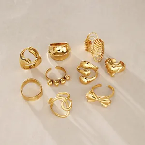 Set of 9 elegant gold stainless steel rings with unique artistic and geometric designs
