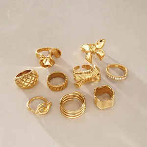 Set of diverse gold stainless steel rings in minimalist and vintage styles